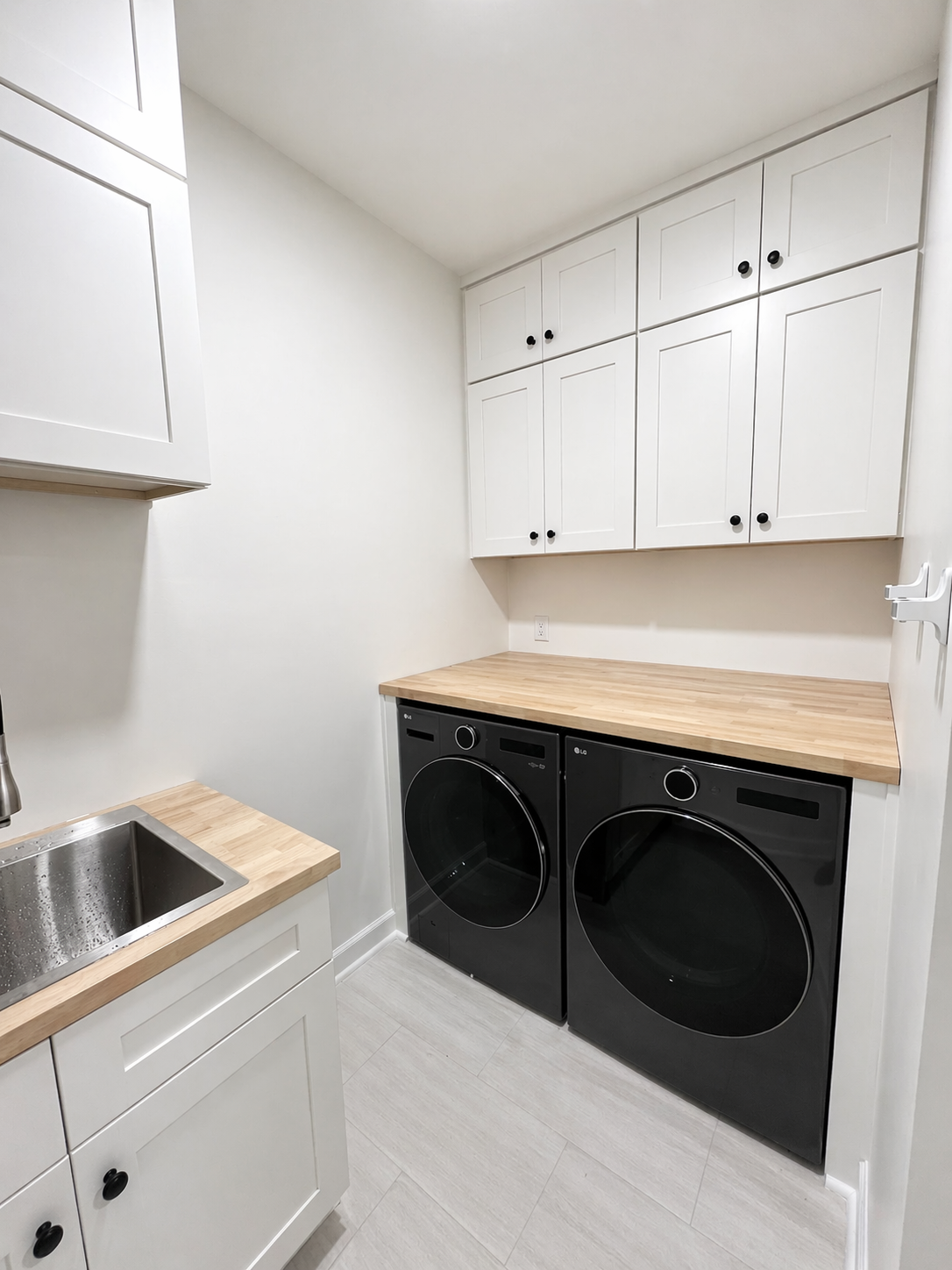 Finished laundry room with butcher-block counter